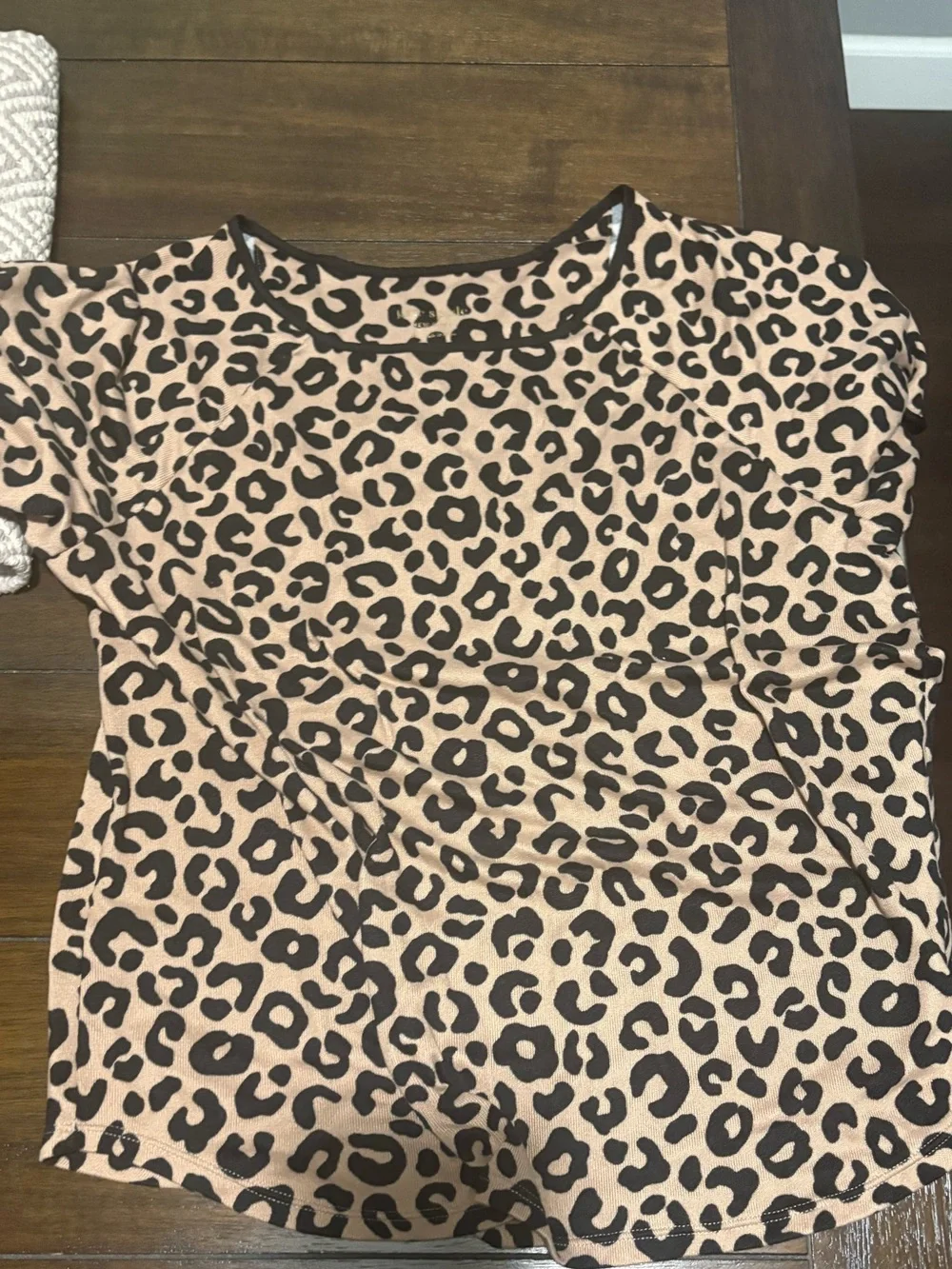 Woman Kate Spade Leopard Print pajamas.